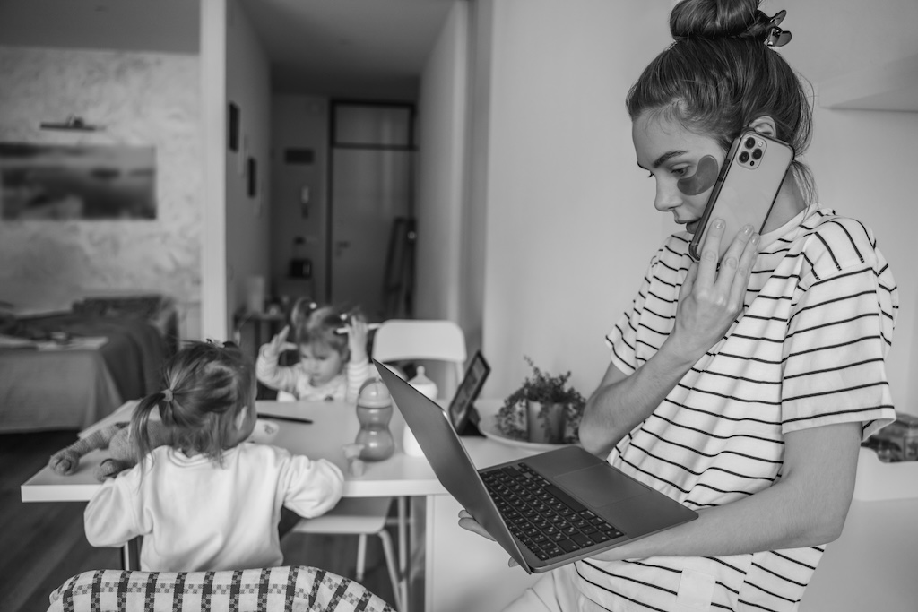 Busy remote worker and her children in the kitchen